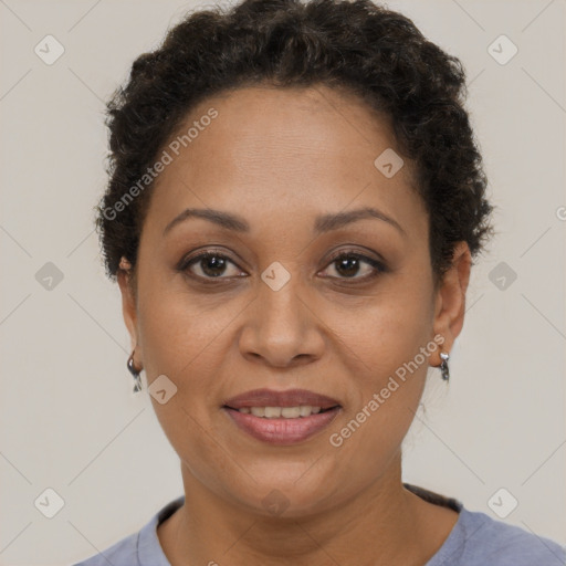 Joyful black adult female with short  brown hair and brown eyes