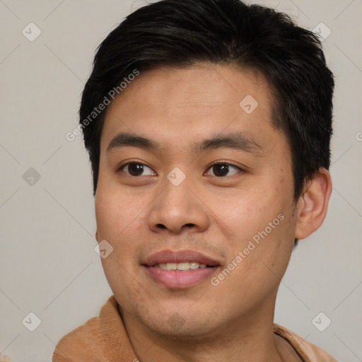 Joyful asian young-adult male with short  brown hair and brown eyes