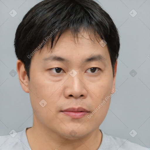 Neutral asian young-adult male with short  brown hair and brown eyes