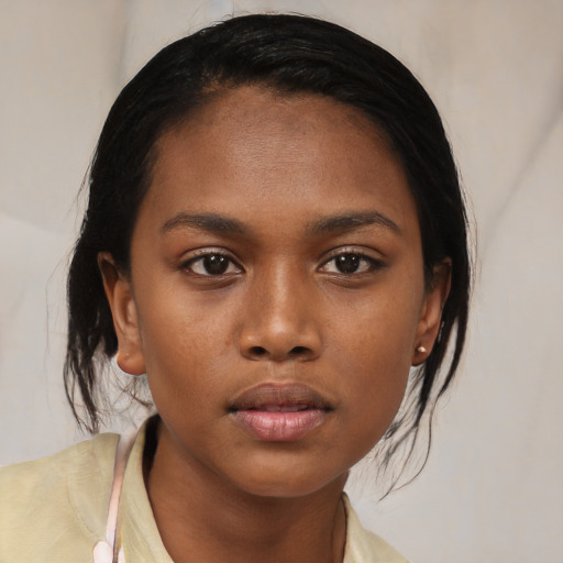 Neutral black young-adult female with medium  black hair and brown eyes