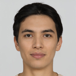 Joyful asian young-adult male with short  black hair and brown eyes