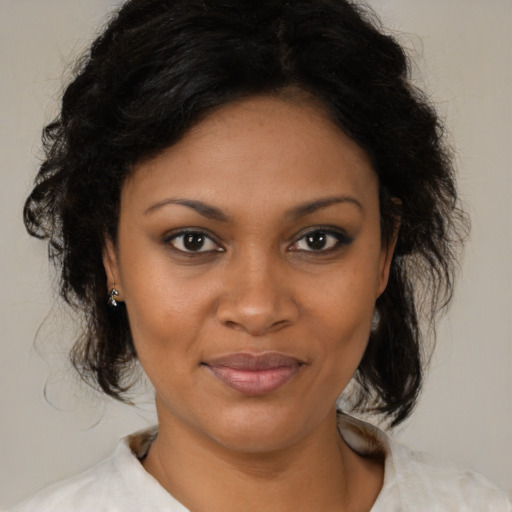 Joyful black young-adult female with medium  brown hair and brown eyes