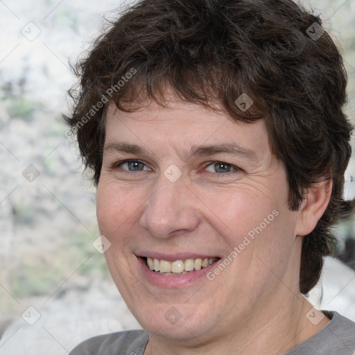 Joyful white adult male with medium  brown hair and brown eyes