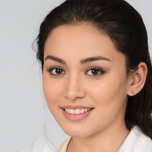 Joyful white young-adult female with medium  brown hair and brown eyes