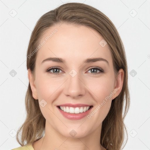 Joyful white young-adult female with long  brown hair and grey eyes