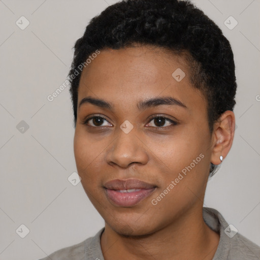 Joyful black young-adult female with short  black hair and brown eyes