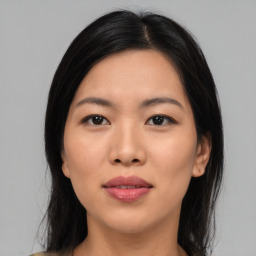 Joyful asian young-adult female with medium  black hair and brown eyes