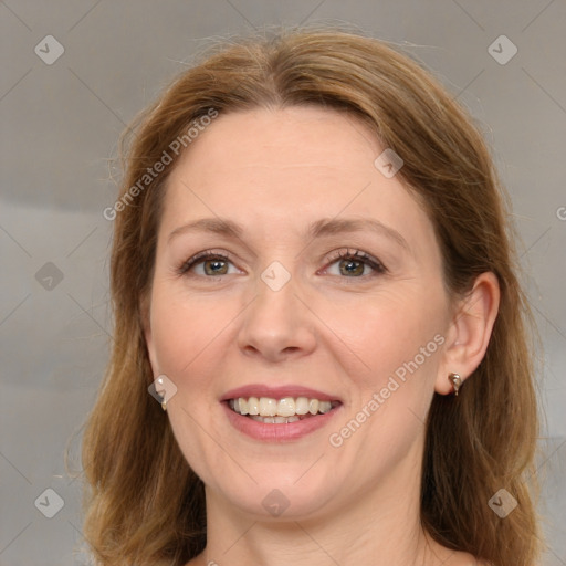 Joyful white young-adult female with medium  brown hair and green eyes