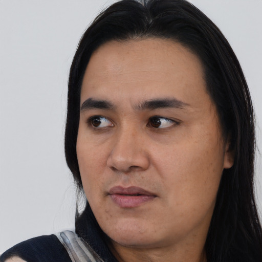 Joyful asian young-adult male with long  black hair and brown eyes
