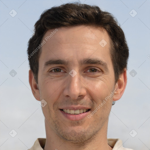 Joyful white adult male with short  brown hair and brown eyes