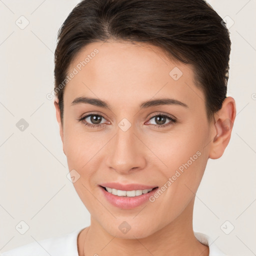 Joyful white young-adult female with short  brown hair and brown eyes