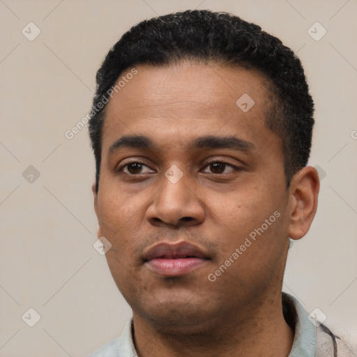 Neutral latino young-adult male with short  black hair and brown eyes