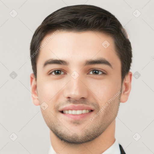 Joyful white young-adult male with short  brown hair and brown eyes