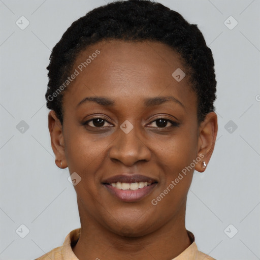 Joyful black young-adult female with short  black hair and brown eyes