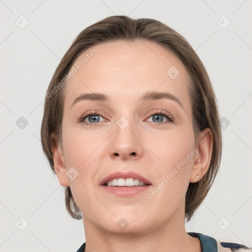 Joyful white young-adult female with medium  brown hair and grey eyes