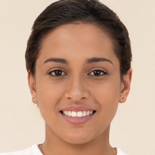 Joyful white young-adult female with short  brown hair and brown eyes