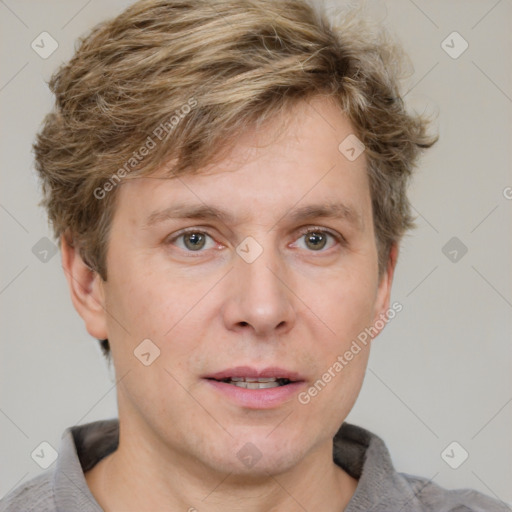 Joyful white adult male with short  brown hair and grey eyes