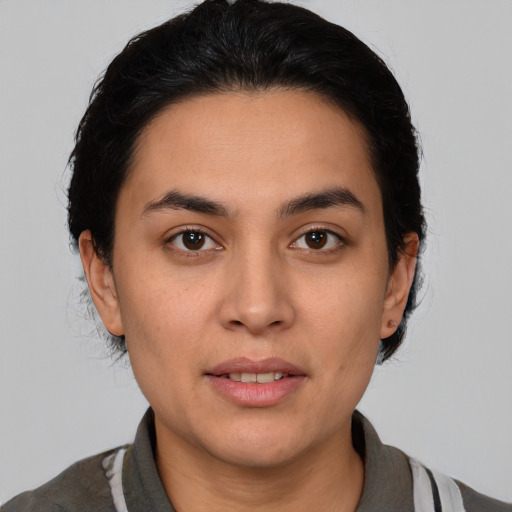Joyful white young-adult female with medium  black hair and brown eyes