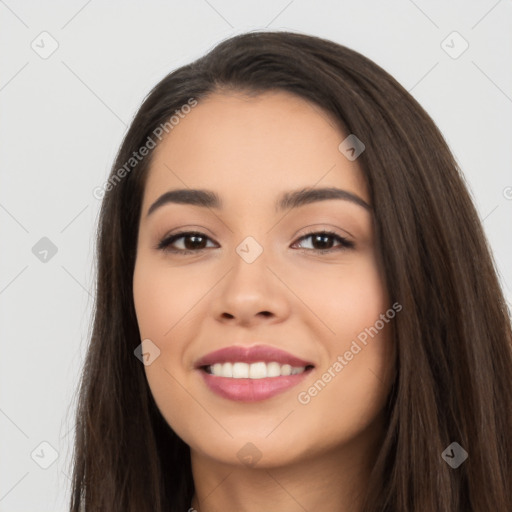 Joyful white young-adult female with long  black hair and brown eyes