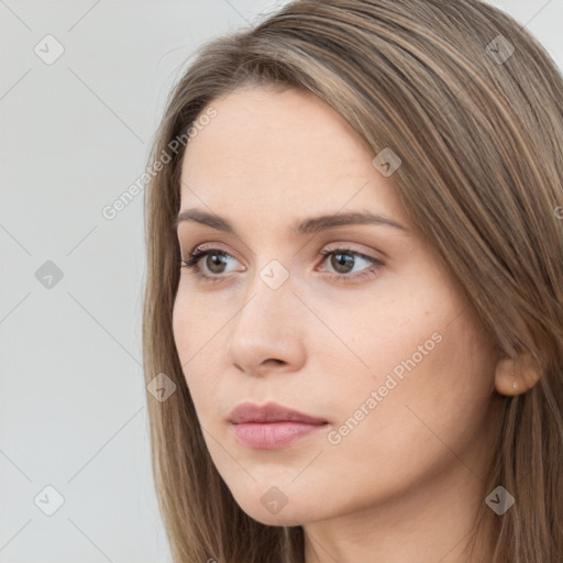 Neutral white young-adult female with long  brown hair and brown eyes