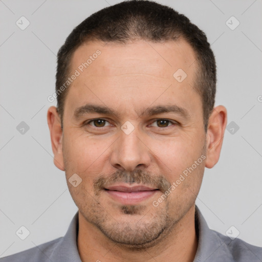 Joyful white adult male with short  brown hair and brown eyes