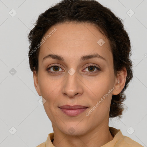 Joyful white adult female with short  brown hair and brown eyes