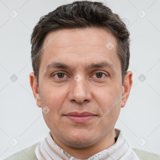 Joyful white adult male with short  brown hair and brown eyes