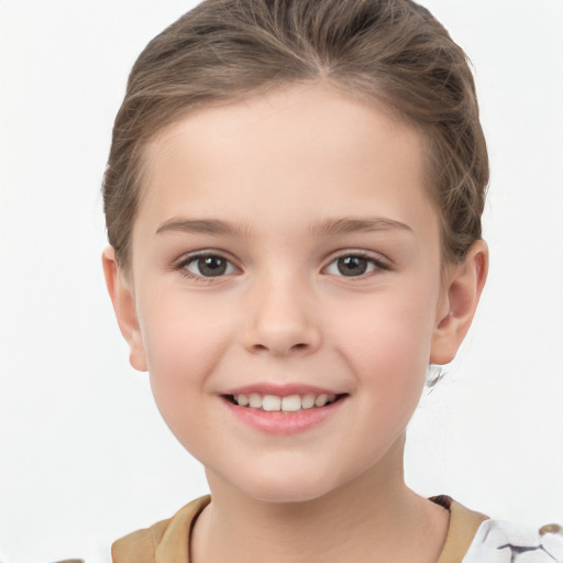 Joyful white child female with short  brown hair and brown eyes