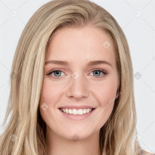 Joyful white young-adult female with long  brown hair and blue eyes