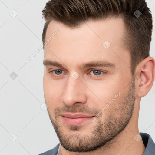 Joyful white young-adult male with short  brown hair and brown eyes