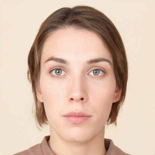 Neutral white young-adult female with medium  brown hair and green eyes