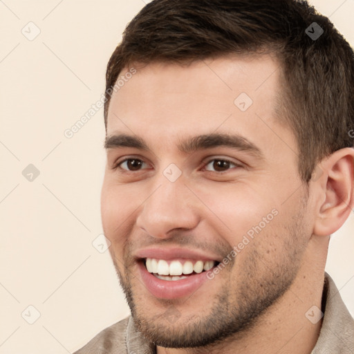 Joyful white young-adult male with short  brown hair and brown eyes