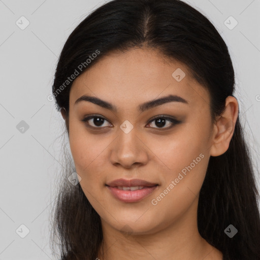 Joyful latino young-adult female with long  brown hair and brown eyes