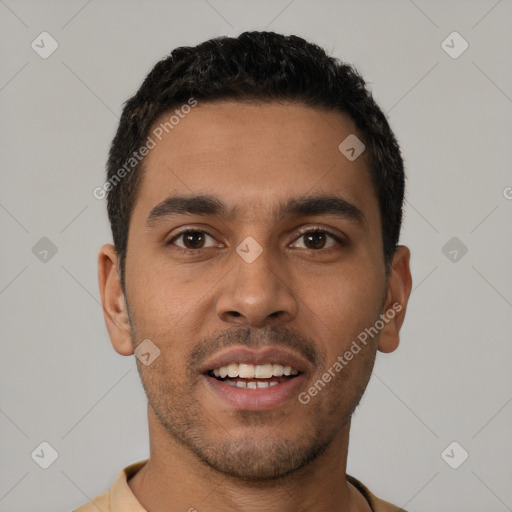 Joyful latino young-adult male with short  black hair and brown eyes