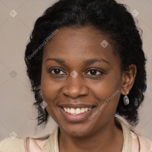 Joyful black young-adult female with long  black hair and brown eyes