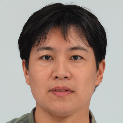 Neutral asian adult male with short  brown hair and brown eyes