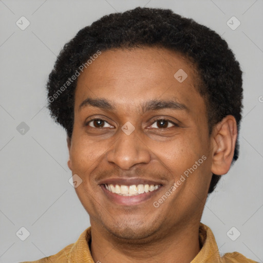 Joyful latino adult male with short  brown hair and brown eyes