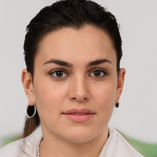 Joyful white young-adult female with short  brown hair and brown eyes