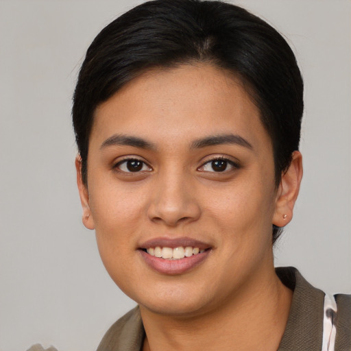 Joyful asian young-adult female with short  brown hair and brown eyes