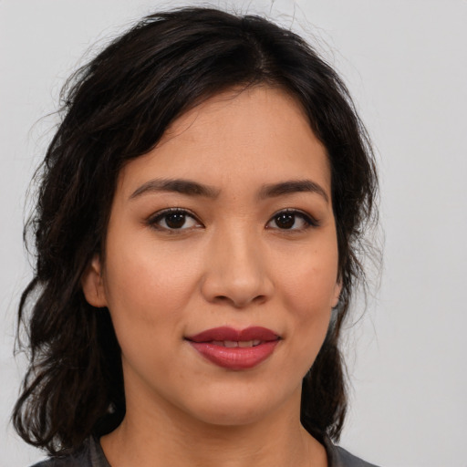 Joyful asian young-adult female with medium  brown hair and brown eyes