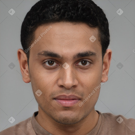 Joyful latino young-adult male with short  brown hair and brown eyes
