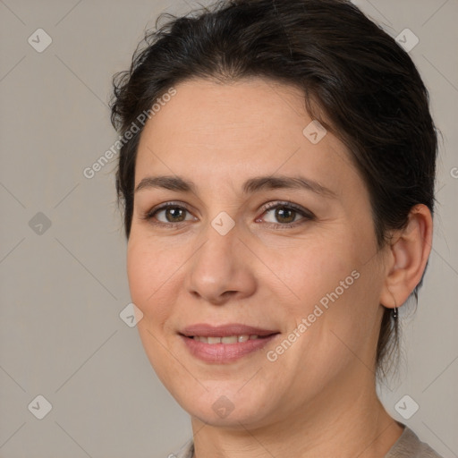 Joyful white adult female with medium  brown hair and brown eyes