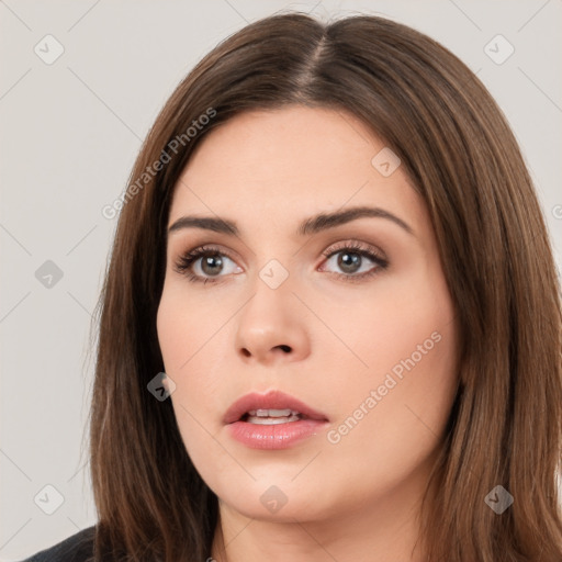 Neutral white young-adult female with long  brown hair and brown eyes