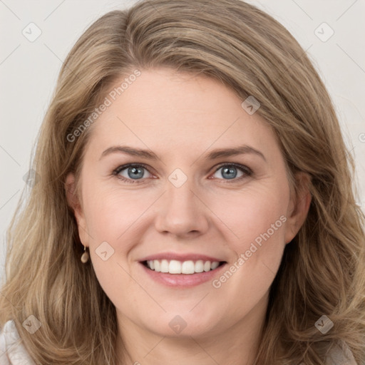 Joyful white young-adult female with long  brown hair and green eyes