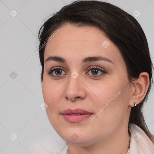 Joyful white young-adult female with medium  brown hair and brown eyes