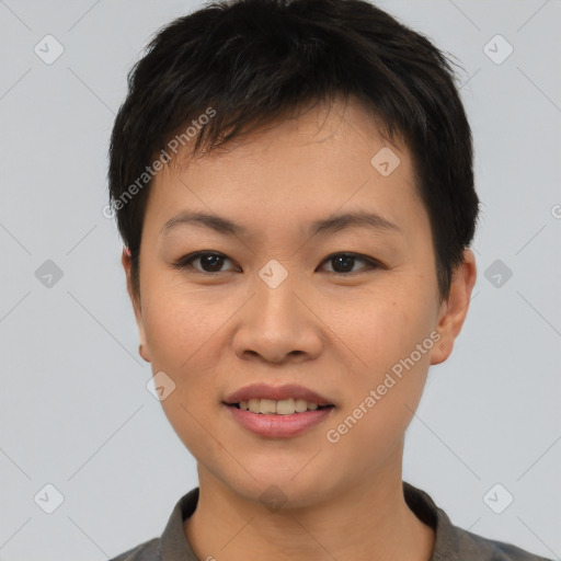 Joyful asian young-adult female with short  brown hair and brown eyes