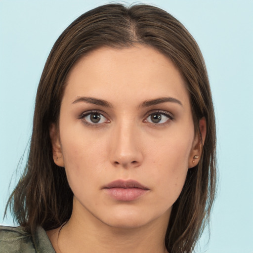 Neutral white young-adult female with long  brown hair and brown eyes