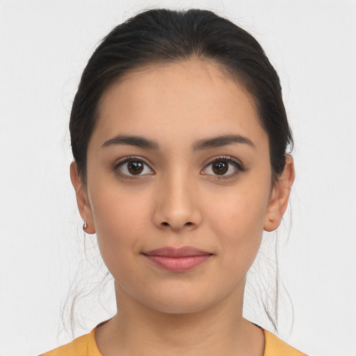 Joyful latino young-adult female with medium  brown hair and brown eyes