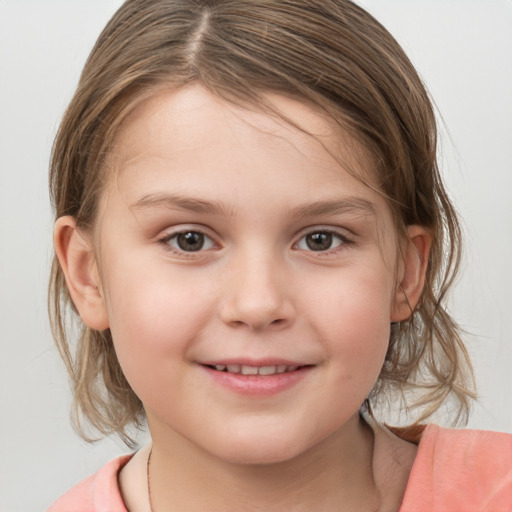 Joyful white child female with medium  brown hair and grey eyes