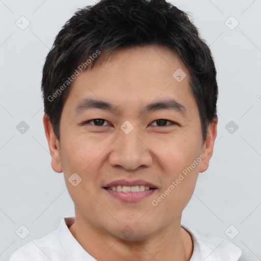 Joyful white young-adult male with short  black hair and brown eyes